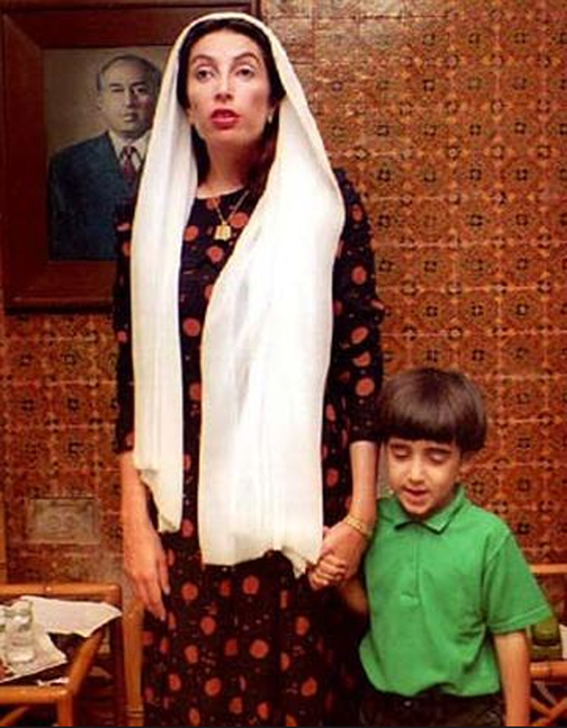Benazir Bhutto's with her son Bilawal, leaves to take a rest after listening to final election results, Oct. 6, 1993, at Naudero, Pakistan. The PPP had claimed early victory nationwide but lost votes in urban cities of Punjab province. PHOTO: AFP