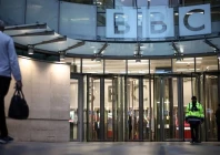 a man walks towards bbc building entrance photo afp
