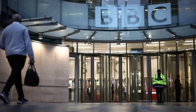 a man walks towards bbc building entrance photo afp