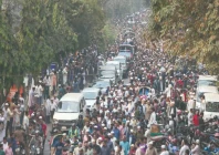 bangladeshis rally along a vehicle carrying the body of youth leader sharif osman hadi as the deceased is taken for burial in dhaka tens of thousands of mourners gathered in the bangladeshi capital for the funeral of the student leader after two days of violent protests over his killing photo afp