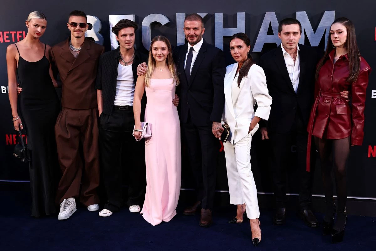 former england footballer david beckham 5th l and his wife victoria beckham 3rd r pose on the red carpet with their children and partners from l mia regan romeo beckham cruz beckham harper beckham brooklyn beckham and nicola peltz beckham upon arrival to attend the premiere of beckham in london on october 3 2023 afp