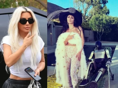 kim kardashian s latest photoshoot with tesla cybertruck and optimus robot goes viral