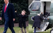 trump and elon musk s son x seen walking hand in hand before boarding marine one to mar a lago trump and elon musk s son x seen walking hand in hand before boarding marine one to mar a lago