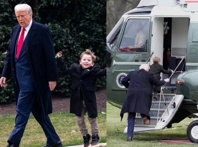 trump and elon musk s son x seen walking hand in hand before boarding marine one to mar a lago