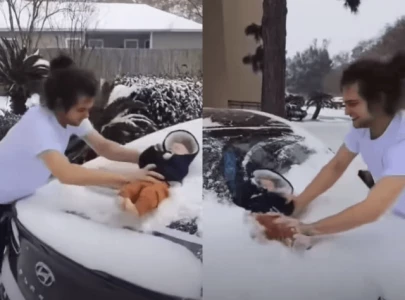 texas man caught on video using three month old baby to wipe snow off car faces possible charges