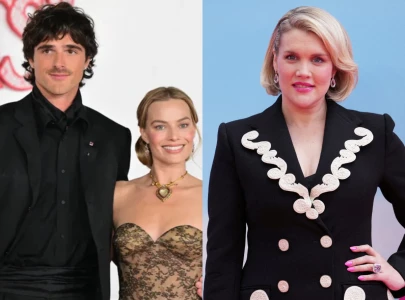 emerald fennell set up shrines of margot robbie and jacob elordi in each other s wuthering heights trailers