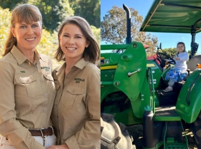 terri irwin shares adorable photos of daughter bindi and granddaughter grace as babies on a tractor