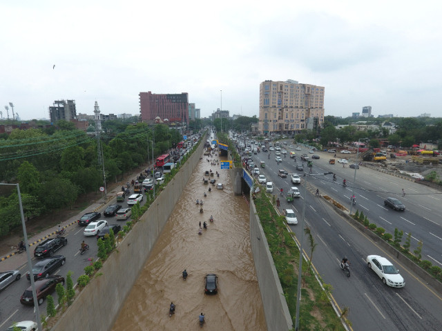 the recently inaugurated kalma chowk underpass in lahore is inundated with rainwater creating difficulties for commuters photo zahoor ahmed express file