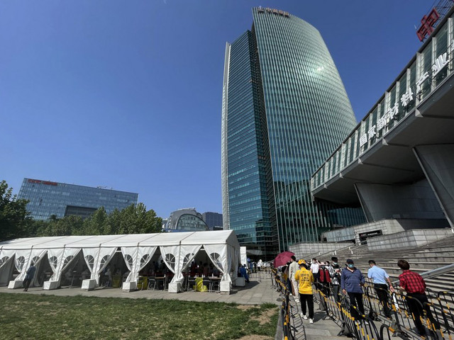 people queue up to take nucleic acid tests in haidian district beijing on may 3 2022 photo xinhua