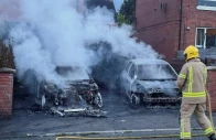 a firefighter works to extinguish a fire in three cars parked on the street at tigers bay during a protest after a knife attack on june 8 left a man seriously injured and prompted police to declare a critical incident in belfast northern ireland on june 9 2026 photo reuters