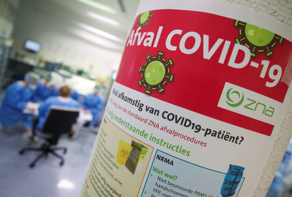 a information sign is seen as members of the medical personnel take part in a meeting at the intensive care unit for patients suffering from the coronavirus disease in antwerp belgium march 31 2021 photo reuters file