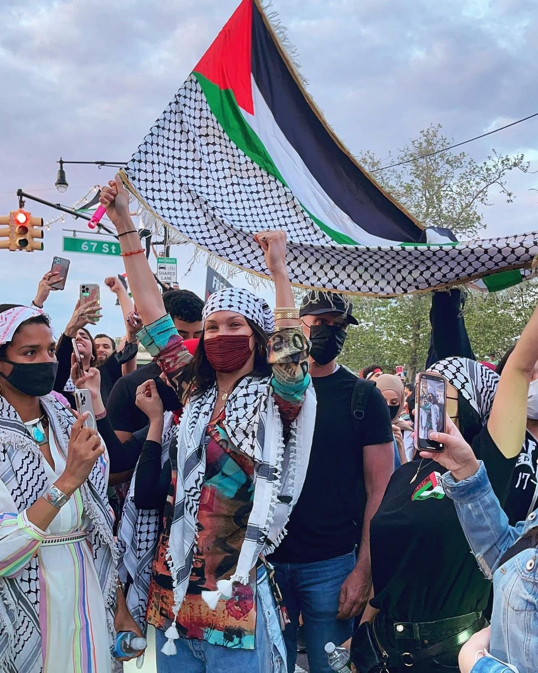 Bella Hadid spotted waving huge Palestinian flag at protest in support of  her family's homeland in NYC