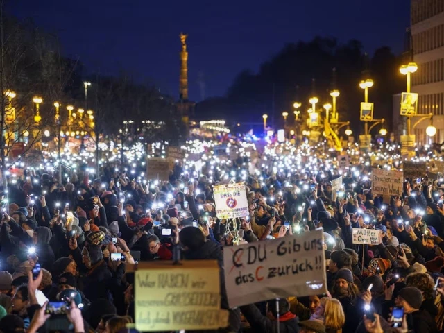 people light up their mobile phones during a protest against the migration plans of the cdu party leader and top candidate for chancellor friedrich merz and the far right alternative for germany party afd in berlin germany on february 2 2025 photo reuters people light up their mobile phones during a protest against the migration plans of the cdu party leader and top candidate for chancellor friedrich merz and the far right alternative for germany party afd in berlin germany on february 2 2025 photo reuters
