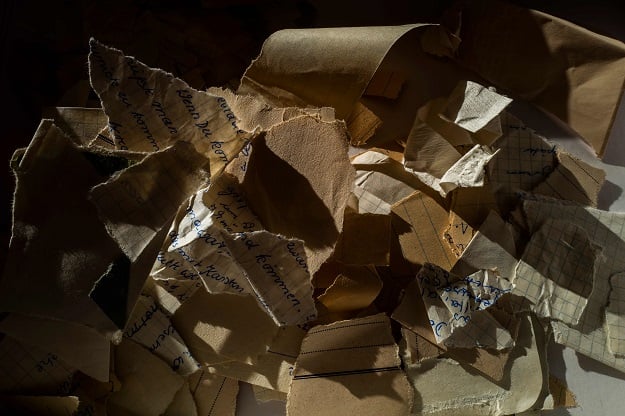 Torn or shredded Stasi documents earmarked for destruction after the fall of the Berlin wall in 1989 are seen in the former headquarters of the Stasi (East German communist secret police), in Berlin (Photo: AFP)