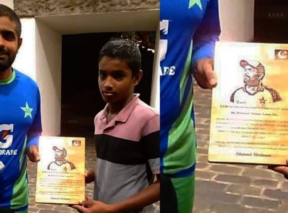 young sri lankan fan gifts shield to his idol babar azam young sri lankan fan gifts shield to his idol babar azam