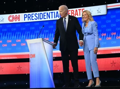 jill biden assists joe off the stage after trump showdown