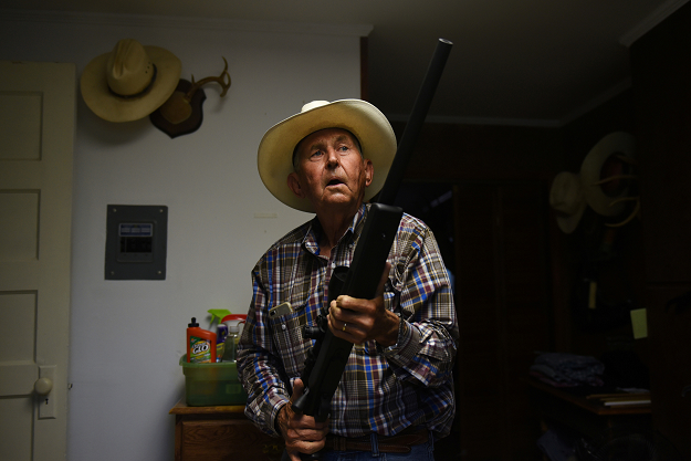 Bill Martin, 72, displays a gun from his collection at his home in Carizzo Springs, Texas. PHOTO: REUTERS
