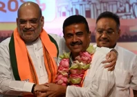 india s home minister amit shah l greets bharatiya janata party bjp leader and newly selected chief minister of west bengal suvendu adhikari c during a party meeting in kolkata on may 8 2026 photo afp