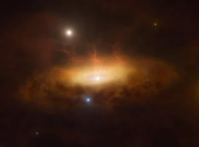 nearby galaxy s dormant black hole shows signs of awakening