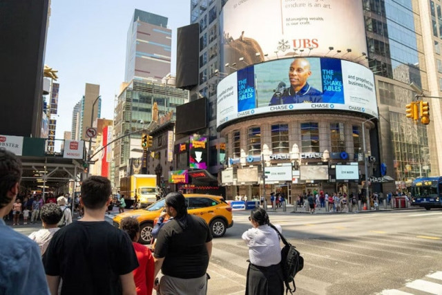 people stand near the blacked out digital billboards at times square following a global it outage in new york city us july 19 2024 photo reuters people stand near the blacked out digital billboards at times square following a global it outage in new york city us july 19 2024 photo reuters