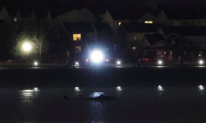 a partially submerged object is seen near ronald reagan national airport in washington on january 31 in the aftermath of the collision of a commercial flight and an army helicopter that crashed into the potomac river photo reuters