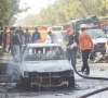 police and rescue officials stand at the site of a blast outside a court building in islamabad photo reuters