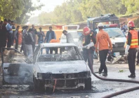 police and rescue officials stand at the site of a blast outside a court building in islamabad photo reuters