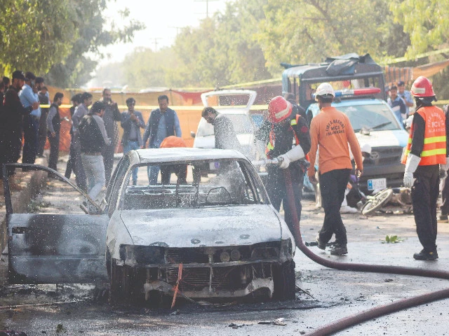 police and rescue officials stand at the site of a blast outside a court building in islamabad photo reuters police and rescue officials stand at the site of a blast outside a court building in islamabad photo reuters