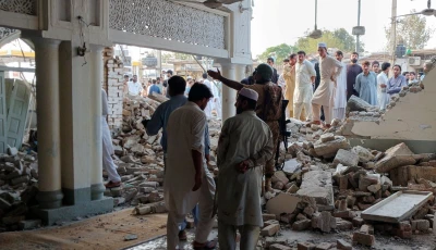 people gather at a damaged mosque following a blast at a police facility in kohat on september 18 2026 photo reuters