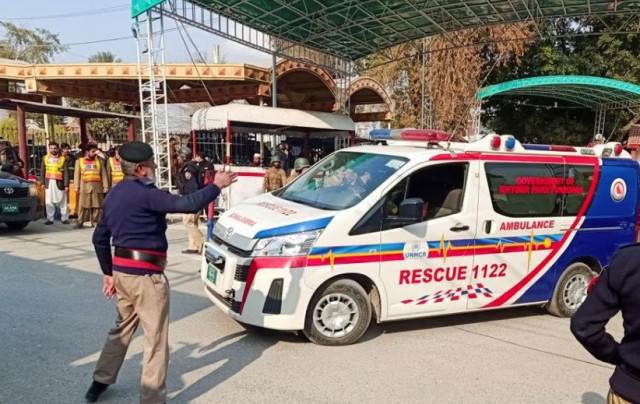 a police officer guides an ambulance after a suicide blast in a mosque at police line area in peshawar pakistan january 30 2023 reuters fayaz aziz a police officer guides an ambulance after a suicide blast in a mosque at police line area in peshawar pakistan january 30 2023 reuters fayaz aziz