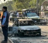 policemen examine damaged vehicles after a suicide blast outside the district court in islamabad on november 11 2025 photo afp