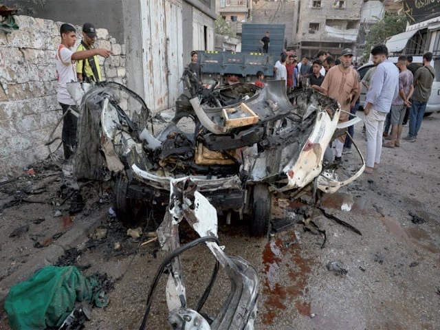 civilian impact palestinians inspect the site of an israeli strike on a vehicle in gaza city photo reuters civilian impact palestinians inspect the site of an israeli strike on a vehicle in gaza city photo reuters