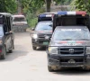 police vehicles are parked outside district headquarters hospital in muzaffargarh punjab on july 29 2015 photo reuters