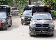 police vehicles are parked outside district headquarters hospital in muzaffargarh punjab on july 29 2015 photo reuters