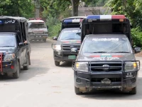 police vehicles are parked outside district headquarters hospital in muzaffargarh punjab on july 29 2015 photo reuters