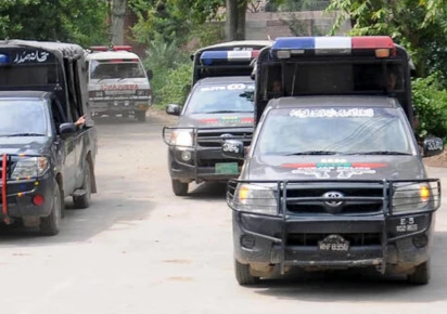 police vehicles are parked outside district headquarters hospital in muzaffargarh punjab on july 29 2015 photo reuters