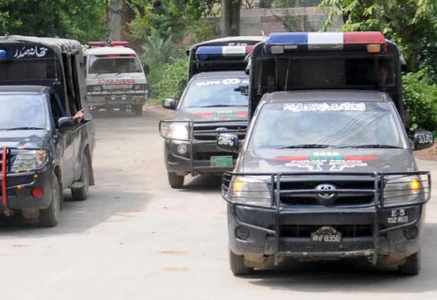 police vehicles are parked outside district headquarters hospital in muzaffargarh punjab on july 29 2015 photo reuters