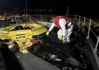 a red crescent worker moves a body bag after two boats carrying migrants capsized off the libyan coastal city of al khums causing multiple casualties in a location given as khums libya november 15 2025 photo reuters