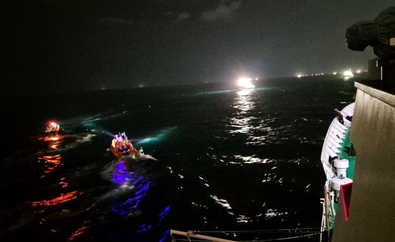 this handout photo taken and released on nov 8 2024 by jeju coast guard shows south korean coast guard boats searching for missing persons in waters off jeju island photo afp