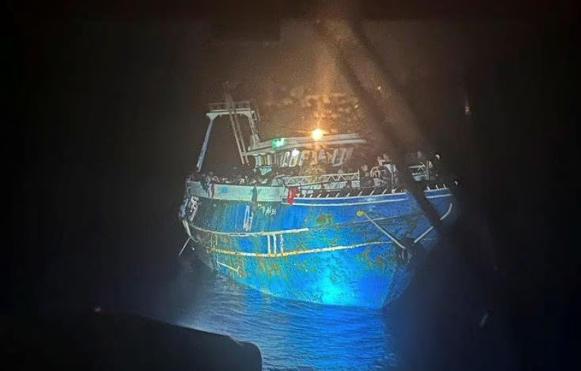 a undated handout photo provided by the hellenic coast guard shows migrants onboard a boat during a rescue operation before their boat capsized at open sea off greece hellenic coast guard handout via reuters file photo