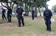 the police search for evidence around the area where the bondi beach shooting took place in sydney on december 16 2025 australia s leaders have agreed to toughen gun laws after attackers killed 15 people at a jewish festival on bondi beach the worst mass shooting in decades decried as antisemitic terrorism by authorities photo afp