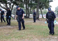 the police search for evidence around the area where the bondi beach shooting took place in sydney on december 16 2025 australia s leaders have agreed to toughen gun laws after attackers killed 15 people at a jewish festival on bondi beach the worst mass shooting in decades decried as antisemitic terrorism by authorities photo afp
