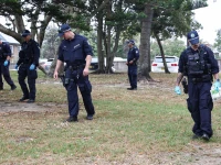 the police search for evidence around the area where the bondi beach shooting took place in sydney on december 16 2025 australia s leaders have agreed to toughen gun laws after attackers killed 15 people at a jewish festival on bondi beach the worst mass shooting in decades decried as antisemitic terrorism by authorities photo afp