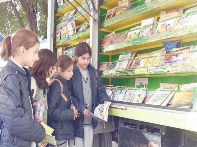 students browse a collection of children s reading books engrossed in the illustrated stories at the 11th international book mela at lok virsa in the federal capital photo online