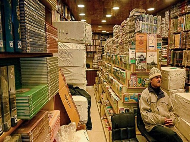 a shopkeeper waits for customers at a bookshop in occupied srinagar on february 18 afp