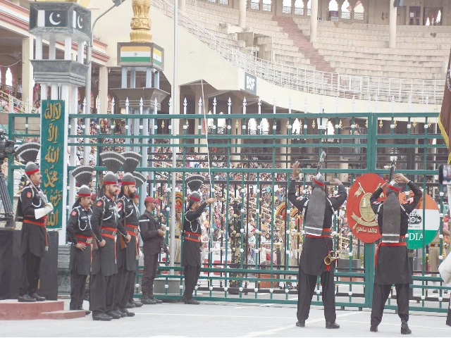 rangers personnel lower the pakistan flag at a ceremony at wagah photo online rangers personnel lower the pakistan flag at a ceremony at wagah photo online