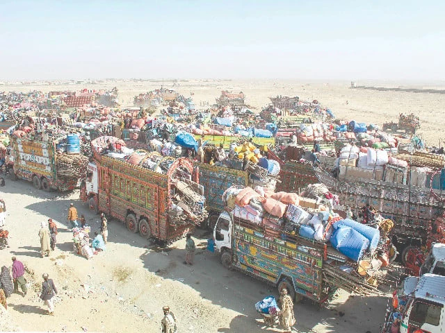 afghan refugees along with their belongings on trucks await deportation to afghanistan near the chaman border crossing photo afp afghan refugees along with their belongings on trucks await deportation to afghanistan near the chaman border crossing photo afp