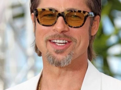 when is brad pitt s isle of man movie filming and why was he spotted at the legendary tt race