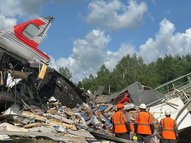 specialists of emergency services work at the scene after a road bridge collapsed onto railway tracks due to an explosion in the bryansk region russia on june 1 photo reuters specialists of emergency services work at the scene after a road bridge collapsed onto railway tracks due to an explosion in the bryansk region russia on june 1 photo reuters