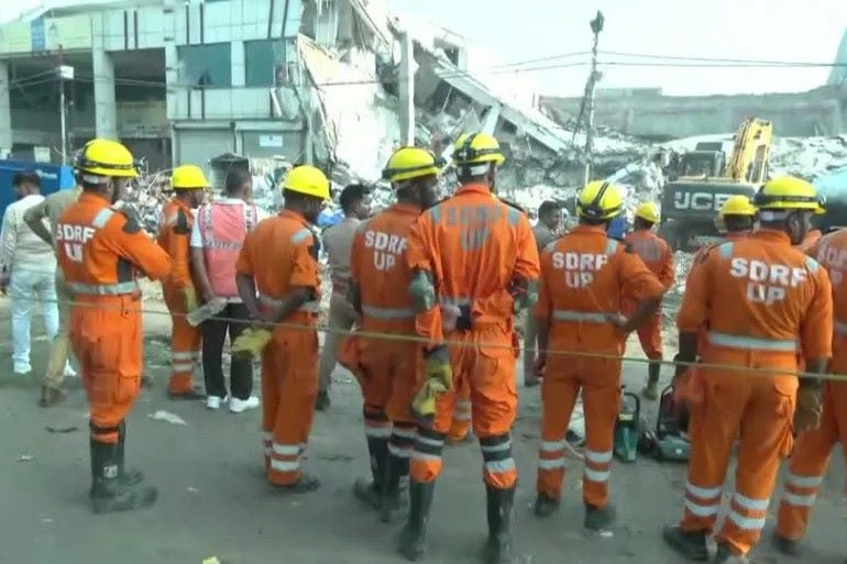 the commercial building which had been used by multiple small companies including as a warehouse and as a vehicle workshop collapsed on saturday afternoon killing at least eight people screengrab reuters